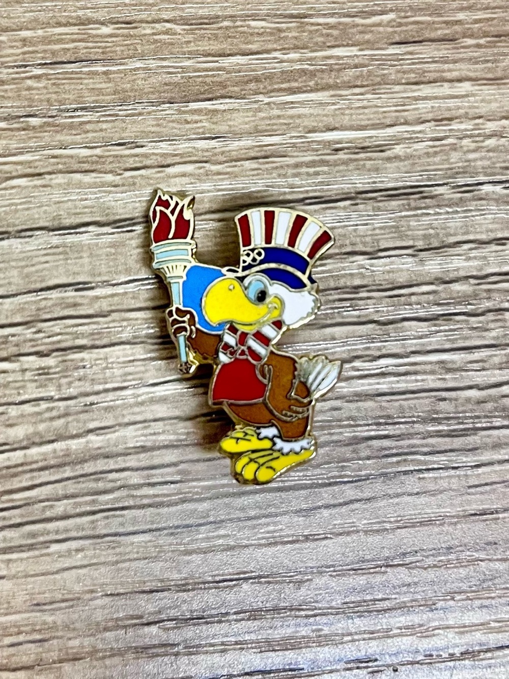 1984 Los Angeles Olympics Sam The Eagle Holding Olympic Torch Lapel Hat Pin